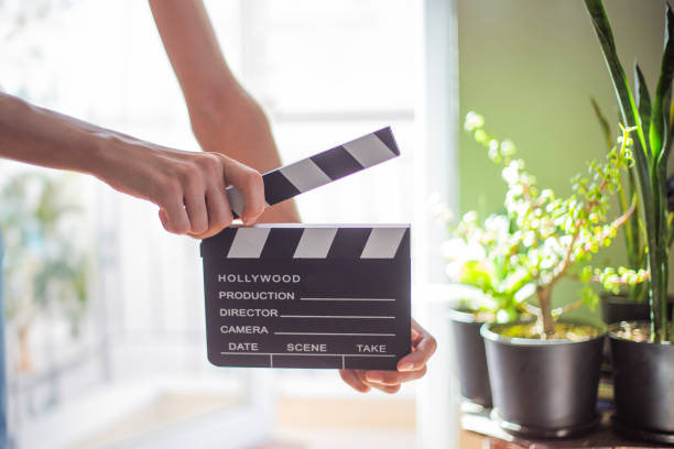 istock Man holding a movie clapperboard 1699906688