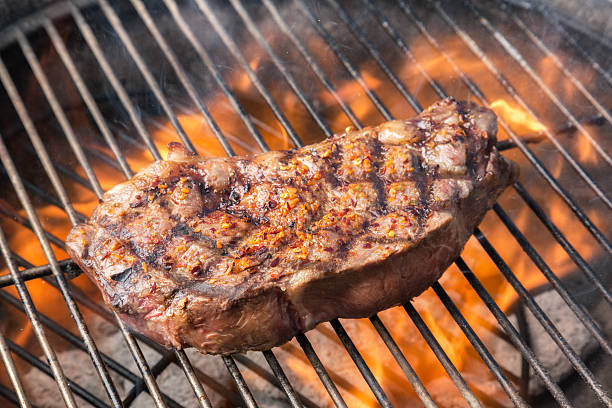istock Kobe New York Steak on Grill with Fire 169991061