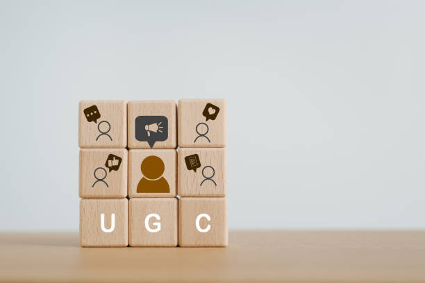 istock User-generated content concept.(UGC) Online marketing concept. Customer create content on social media . Close up arranged wooden cube with white UGCabbreviation and icon , copy space 1699922311