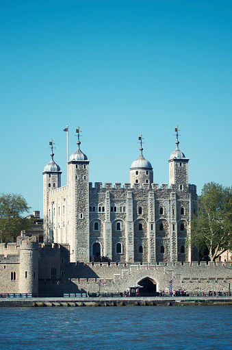 Medieval (founded in 1066) Tower of London fortress with River Thames in the foreground