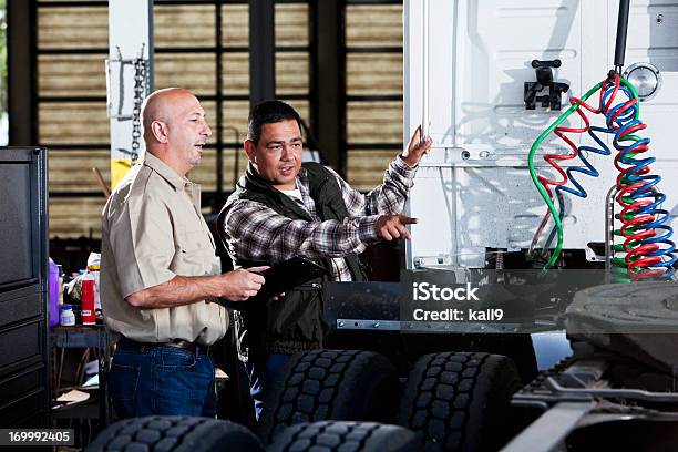 Men In Garage With Semitruck Stock Photo - Download Image Now - Truck, Repairing, Semi-Truck