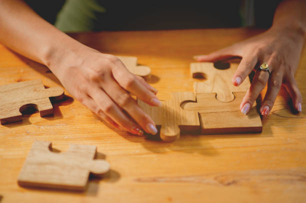 istock jigsaw, puzzle pieces, wooden jigsaw, unity, building blocks and teamwork Connection and communication 1699924569