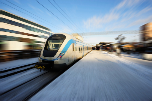 Local train in Sollentuna, just north of Stockholm. Zoom blurred picture. Focus on train front.