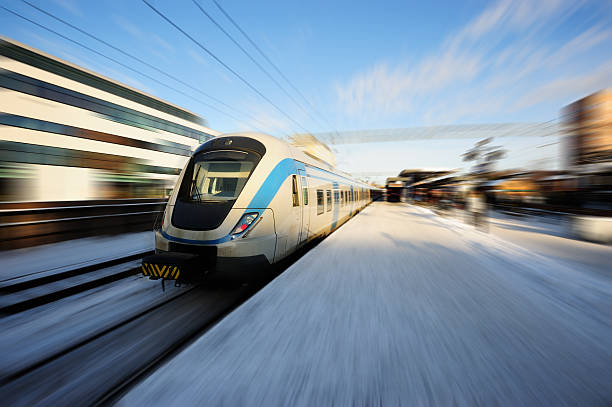 Commuter train Local train in Sollentuna, just north of Stockholm. Zoom blurred picture. Focus on train front. stockholm photos stock pictures, royalty-free photos & images