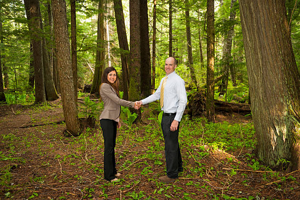 Business team in a lush green forest