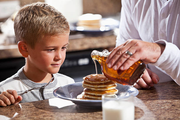 istock Little boy being served pancakes for breakfast 169995637