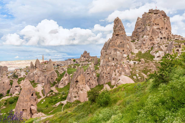 istock Uchisar citadel. General view with clouds at background. Cappadocia, Turkey 1699956783