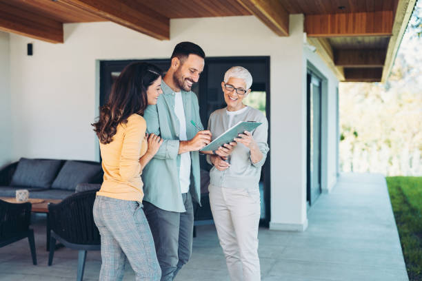 istock Young couple buying a house 1699958369