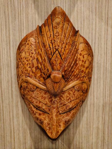 istock wooden mask decorations attached to the wall 1699969510