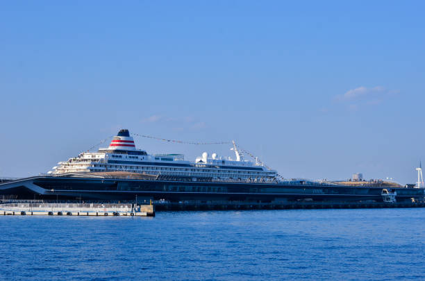 Yokohama, Japan - Jan 4, 2017. The big ship is the Asuka II, which is moored at the main pier in Minato Mirai, Yokohama.\n\nMinato Mirai is popular in a Kanagawa. \nThere are also business districts, stadiums, shopping malls, ports, amusement parks, and historic buildings nearby.\nThis place \