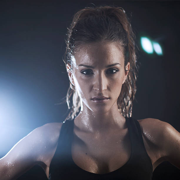 istock Young woman exercicing in the gym 169997983