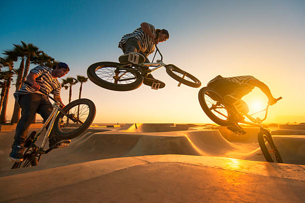 BMX Biker A sequence of a BMX biker at the bike at sunset. continuity photos stock pictures, royalty-free photos & images