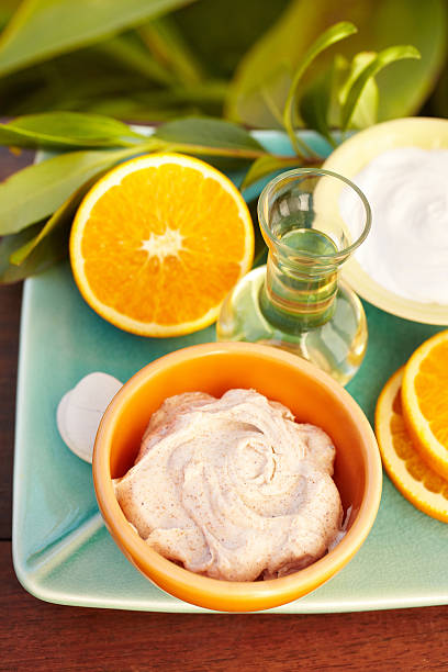 istock Spa exfoliation salt scrub, oranges and moisturizer on a plate 169998722