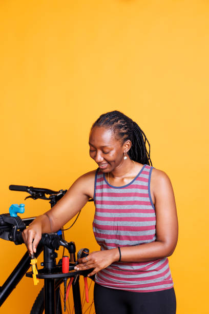 istock Woman Preparing for Bike Maintenance 1699995886