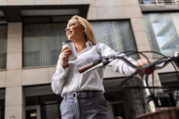 istock Businesswoman, Bicycle, and Coffee 1700000153