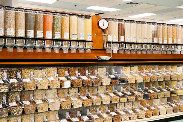 All Natural Bulk Food Dispensers Dispensers in a Natural Food store supplying a large variety of organic foods, such as cereals, whole grains, nuts, legumes, rice and even candy. basic food stock pictures, royalty-free photos & images