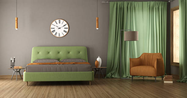 istock Modern bedroom with green double bed and armchair 1700004431
