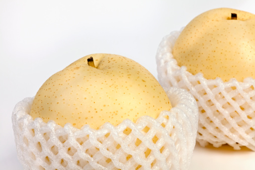 Chinese pear or asian pear with half sliced isolated on white background.