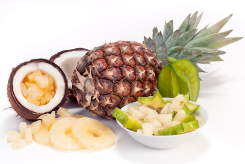 Pineapple, Coconut and Starfruit with fruit salad. Pieces of Pineapple and Starfruit. Isolated on white background.