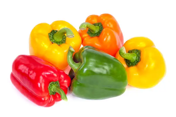 Group of  bell peppers isolated on white background. Green, yellow, red and orange colors.