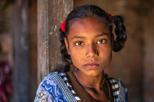 Portrait of young Nepali girl, she lives in Bhaktapur. Bhaktapur is an ancient town in the Kathmandu Valley and is listed as a World Heritage Site by UNESCO for its rich culture, temples, and wood, metal and stone artwork.