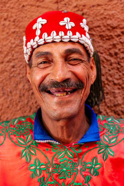 Portrait of street musician in Marrakesh, Morocco Moroccan street musician in traditional costume on Djemaa el Fna square, Marrakech, Morocco. Djemaa el Fna is a heart of Marrakesh's medina quarter. djemma el fna square stock pictures, royalty-free photos & images