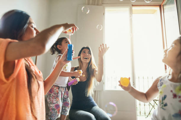 istock Family at home: mothers and daughters relaxing at home 1700013700