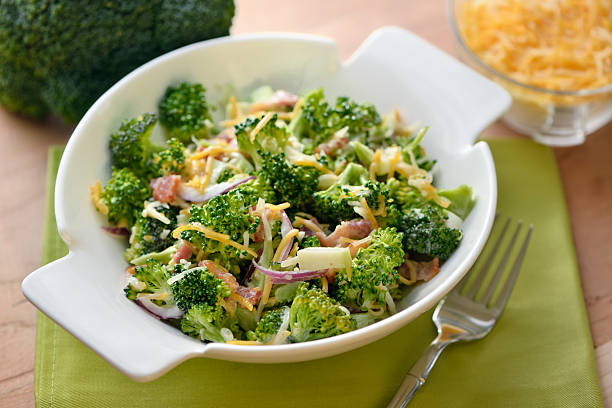 Broccoli Salad Salad bowl with broccoli salad - ingredients: broccoli, cheddar cheese, red onion, bacon with mayonnaise, sugar and vinegar dressing broccoli stock pictures, royalty-free photos & images