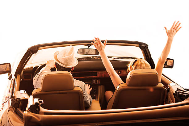 istock Retro couple driving in old timer car. 170003965