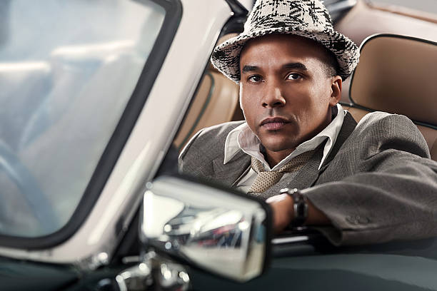 istock Retro mid adult man sitting in old timer car 170004020