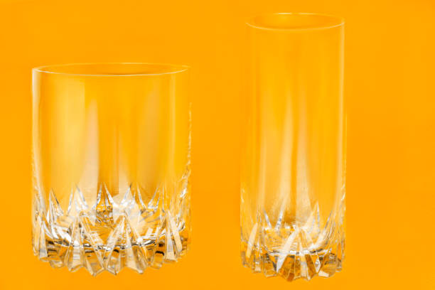 istock Glasses on yellow background 1700041116