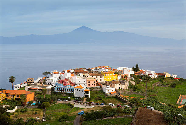 Agulo town and vulcano Teide, Canary Islands Agulo town on La Gomera with volcano Teide on a horizon, Canary Islands agulo stock pictures, royalty-free photos & images