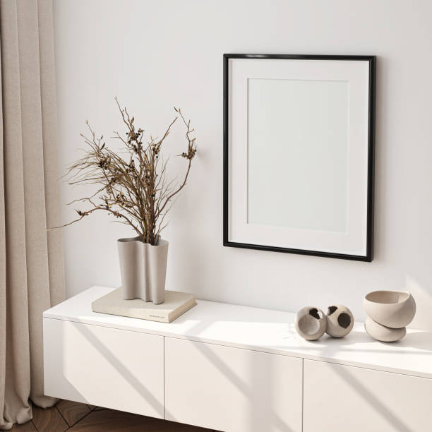 istock Frame mockup, single vertical ISO A paper size, reflective glass, mockup poster on the wall of living room. Interior mockup. Apartment background. Modern interior design. 3D render 1700046224