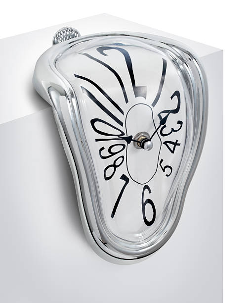 Melting Clock Clock dripping or melting to portray the concept of "time slipping away". salvador dali stock pictures, royalty-free photos & images