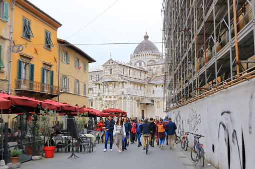 May 18 2023 - Pisa in Italy: People walking in the old town of Pisa