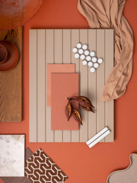 istock Stylish flat lay composition in orange and beige color palette with textile and paint samples, lamella panels and tiles. Architect and interior designer moodboard. Top view. Copy space. 1700069109