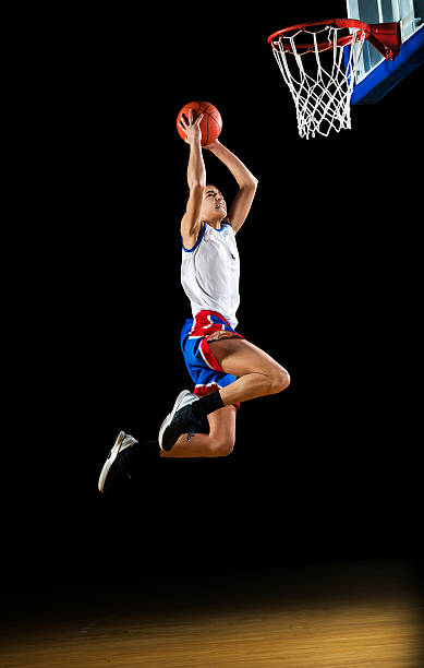istock Basketball player slam dunking the ball. 170007006