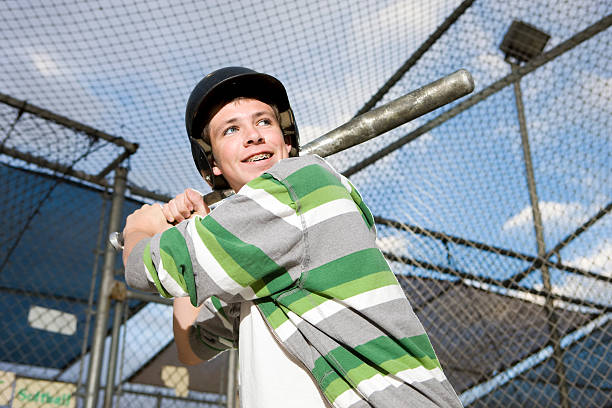istock Boy Swinging Baseball in Batting Cage 170008637