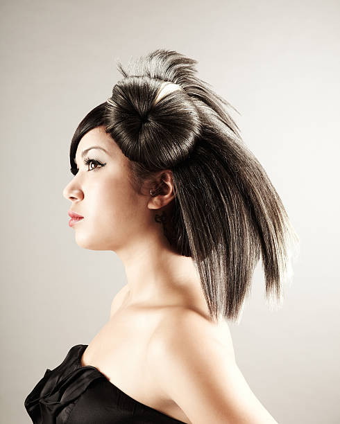 istock Young woman with fashioned hairstyle looking away 170009196