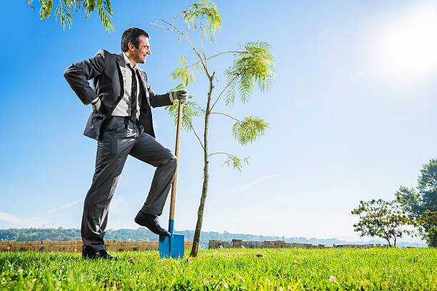 istock Businessman gardening against the sky. 170009766