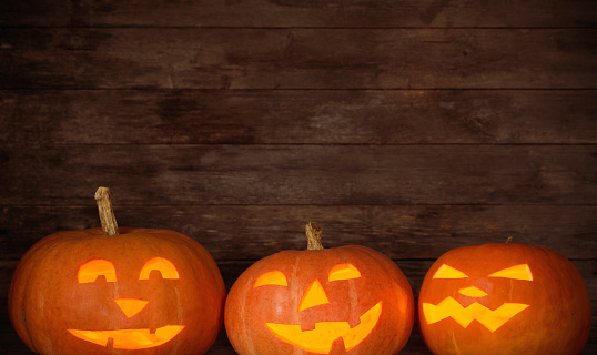 Halloween pumpkin on old wooden background