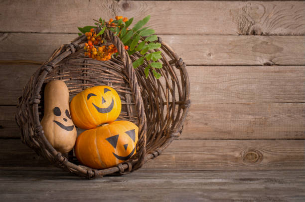 istock halloween pumpkin on old wooden background 1700104199
