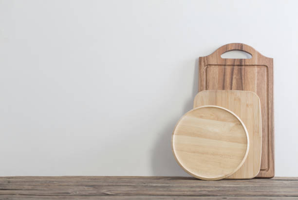 istock cutting board on wooden table on background white wall 1700104207