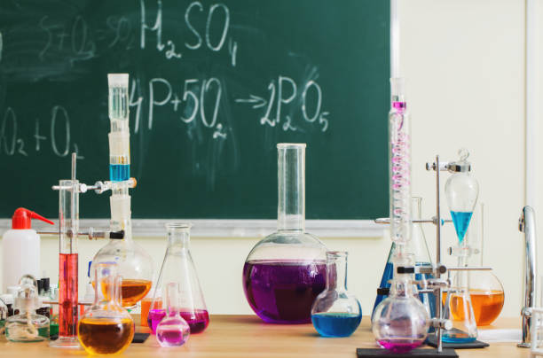 istock Glass flasks with multi-colored liquids at the chemistry lesson 1700104215