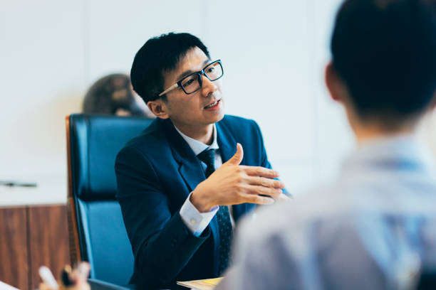 istock Two employees are reporting this month's operational status to the supervisor. 1700109188