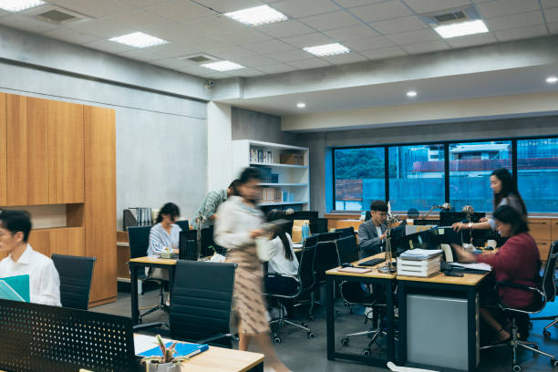 istock A bustling office where employees are working diligently and focused. 1700112071