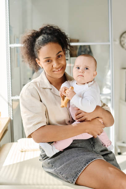 istock Young mother visiting doctor with her baby 1700115584
