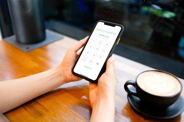 istock Woman hands using mobile banking on smartphone and enter password to login application. 1700116104