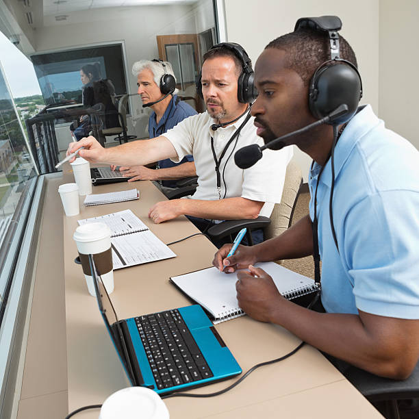 istock Sports commentators discussing play during game from stadium press box 170011683
