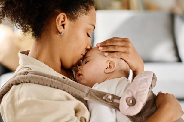 istock Young mother caring about her baby 1700117735
